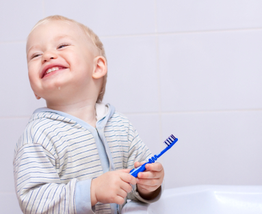 young child cleaning teeth in bathroom iStock_000010951173XSmall (2)