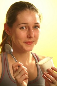 woman eating yogurt